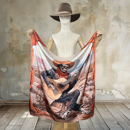 Immerse yourself in the mystique of the Wild West with Desert Serenade Desperado Wild Rag. A skeleton desperado playing a guitar in the desert, surrounded by burnt orange flowers and curtain details, turns the desert into his stage on this 39" square of  100% satin silk. Elevate your style with this uniquely artistic and captivating accessory.